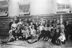 School children and teachers Miss M.Betts and E.A. Smith outside the Bramley Group School